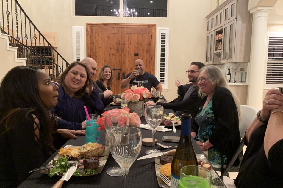 Over the weekend, we hosted a dinner party with the show crew, significant others, and Theresa from Dogwoods. I have no idea what my wife is doing in this picture (she’s the black one…well, the female one)