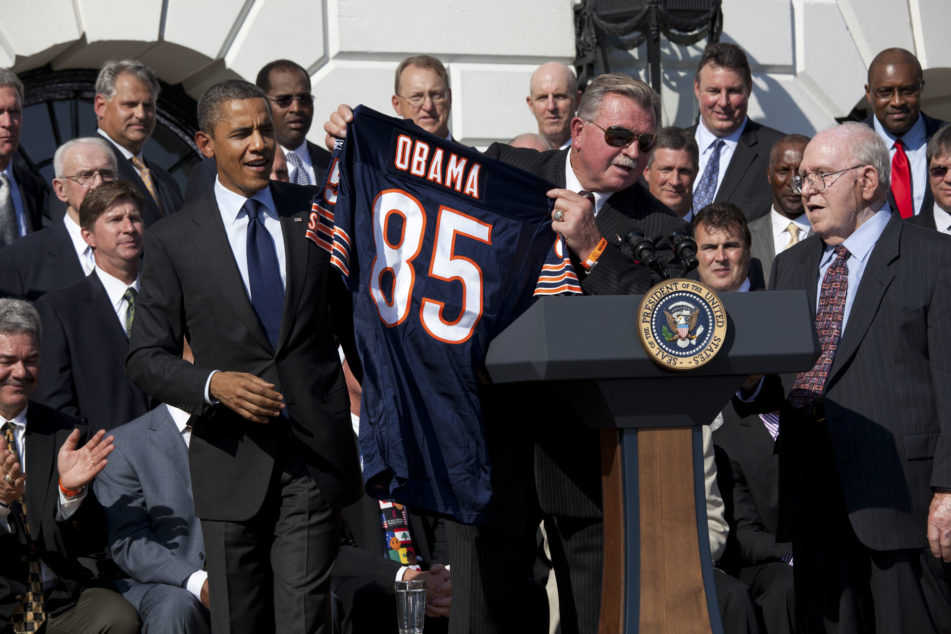 1985 Chicago Bears Coach Mike Ditka and Defensive Co-Ordinator Buddy Ryan, right, present a jersey to President Barack Obama during the ceremony for the 1985 Super Bowl Champion Chicago Bears to celebrate the 25th anniversary of their Super Bowl victory, on the South Portico of the White House, Oct. 7, 2011. In 1986, the teamÕs White House reception was canceled due to the Space Shuttle Challenger tragedy.  (Official White House Photo by Pete Souza)